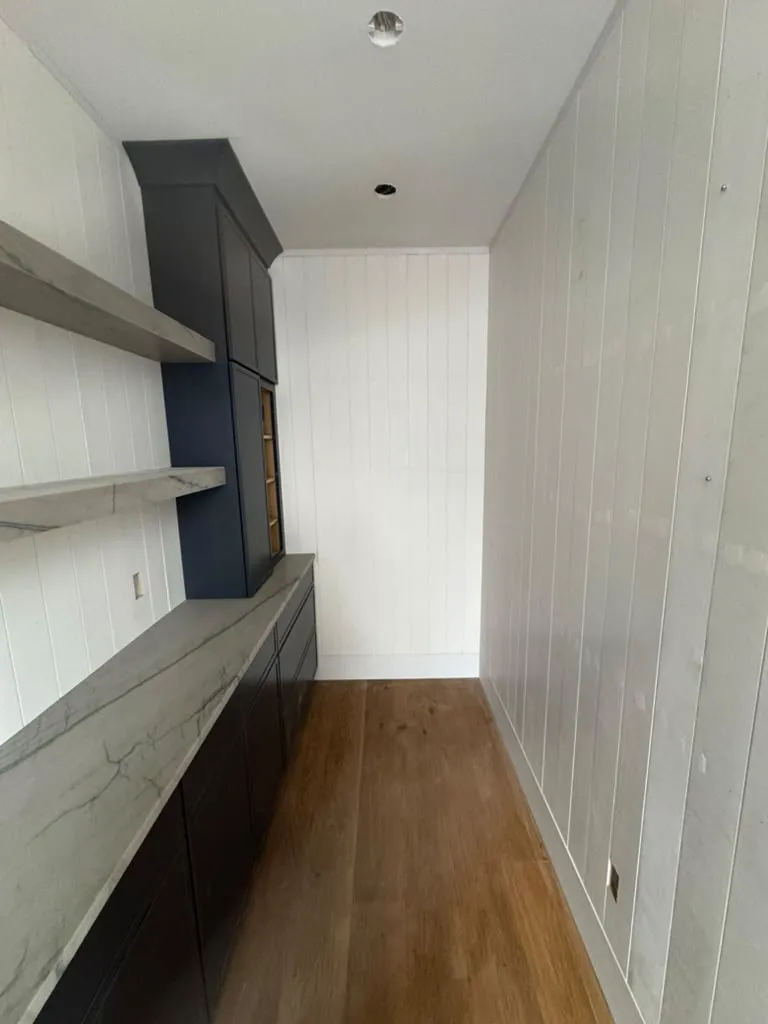 Built-in shelving nook with wood floor